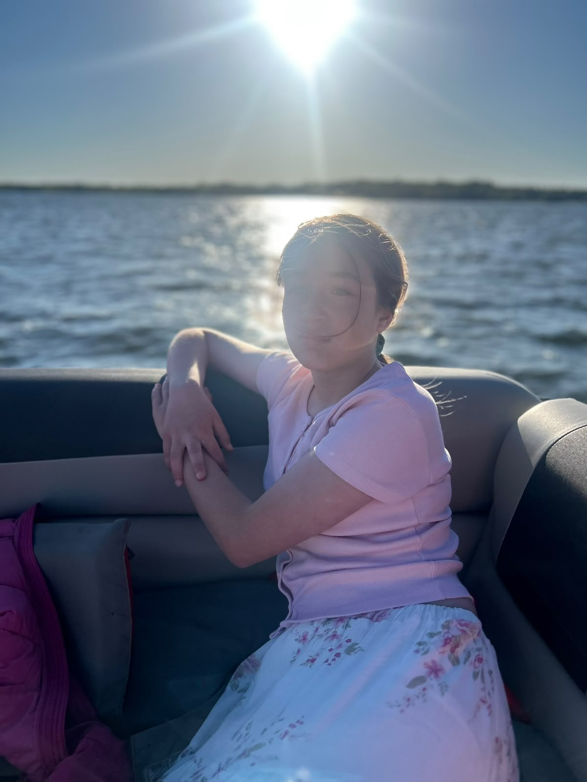 Sham on a boat with the sun behind her