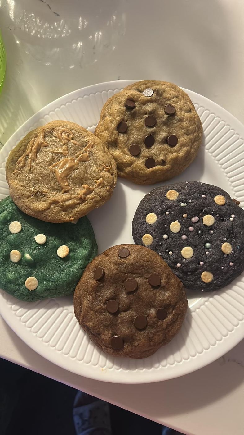 A plate of Sham's cookies: chocolate chip, funfetti, Cookie Monster, galaxy and double chocolate